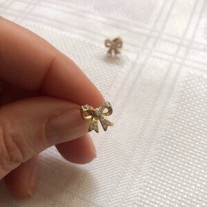 Early 2000 Juicy Couture gold bow earrings with CZ